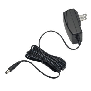 Black AC power adapter with two-prong plug and coiled cord ending in a barrel connector.