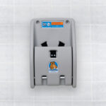 Gray koala-themed baby changing station on tiled wall with safety instructions at the top.