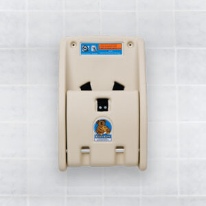 Koala Kare beige baby changing station on tiled wall with safety instructions and koala logo.