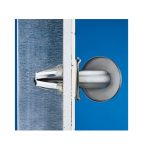 Metal toggle bolt anchor securing a drywall panel against a blue background.