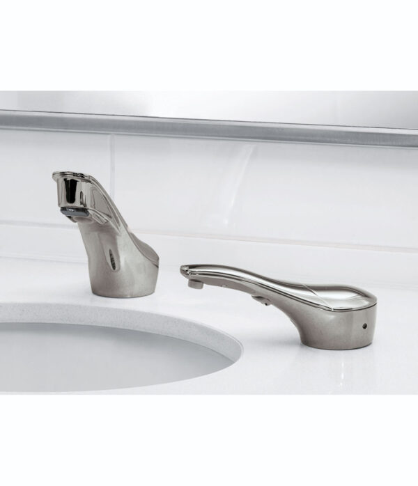 Modern chrome faucet and soap dispenser on a white countertop with tiled wall background.