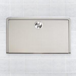 Stainless steel wall-mounted baby changing station on tiled wall, closed panel.