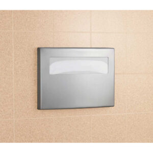 Stainless steel paper towel dispenser on beige tiled wall.