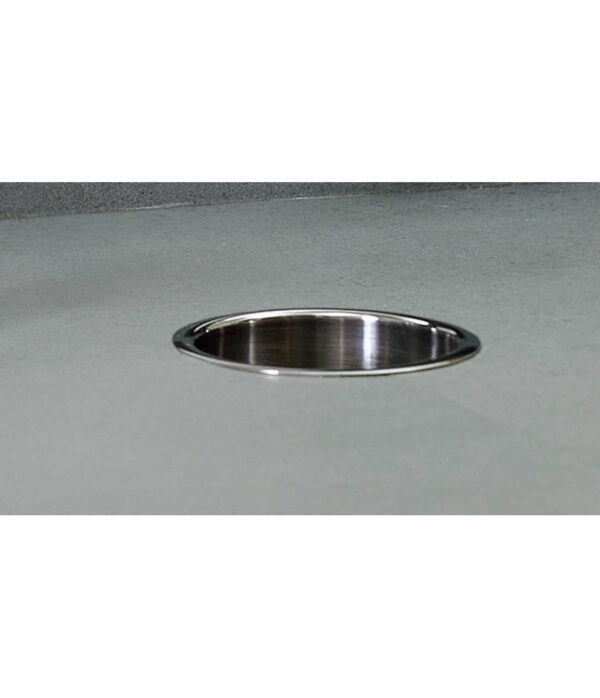 Round stainless steel sink in gray countertop.