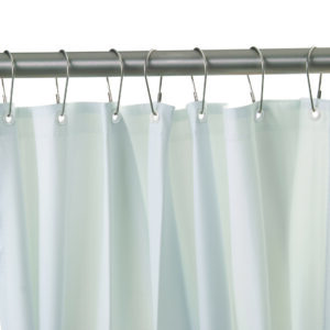 White shower curtain on metal rod with circular hooks and reinforced eyelets.