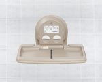 Beige wall-mounted baby changing station on tiled background with foldable surface.