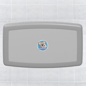 Wall-mounted baby changing station with gray cover and logo, tiled wall background.