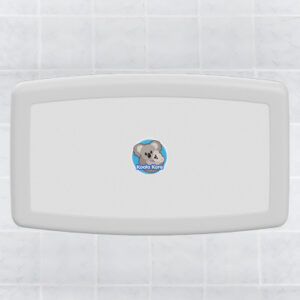 Wall-mounted baby changing station with Koala Kare logo on tiled background.