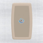 Beige rectangular container with koala logo on a tiled background.
