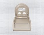 Wall-mounted baby changing station with diagram and safety strap against tiled background.