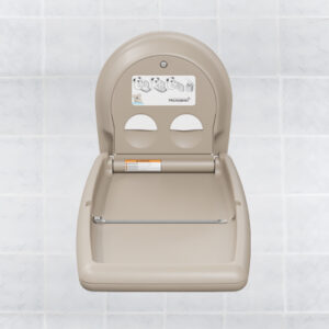 Wall-mounted baby changing station with diagram and safety strap against tiled background.