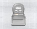 Gray wall-mounted baby changing station with fold-down design against tiled background.
