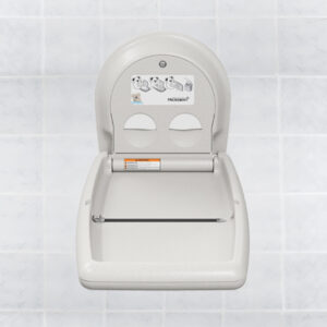 Wall-mounted foldable baby changing station against a tiled background.