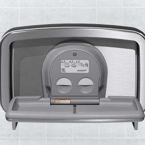 Wall-mounted gray baby changing station with fold-down surface and safety instructions.