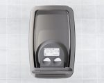 Stainless steel hand dryer on tiled wall with circular buttons and instructions above.