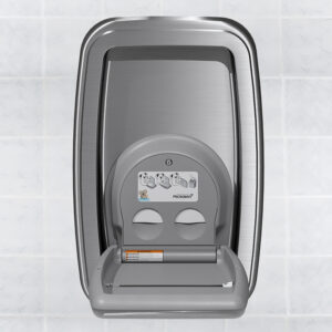 Stainless steel baby changing station on tiled wall with fold-down design and safety labels.