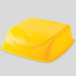 Yellow rectangular plastic cover with smooth edges on a flat surface.